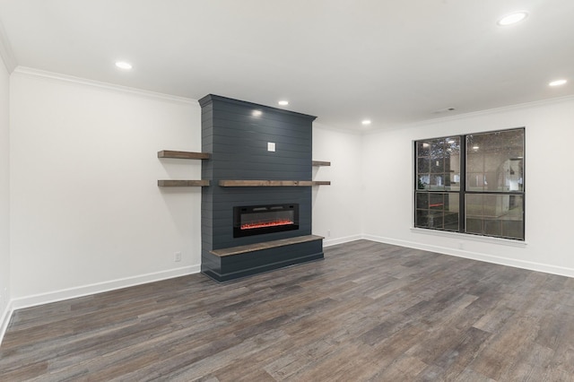 unfurnished living room with a fireplace, dark hardwood / wood-style floors, and ornamental molding