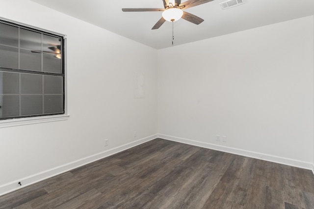 spare room with ceiling fan and dark hardwood / wood-style flooring