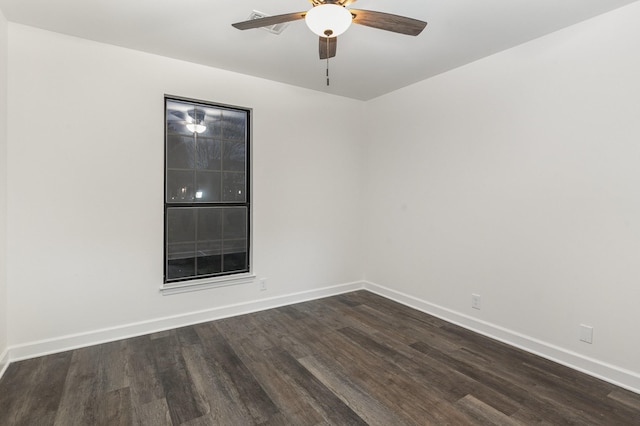 empty room featuring ceiling fan and dark wood-type flooring