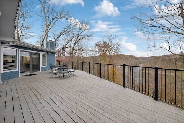 wooden deck featuring a mountain view