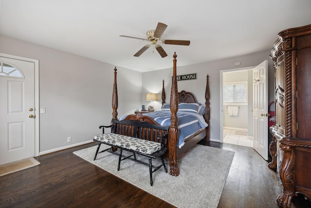 bedroom with ceiling fan, dark hardwood / wood-style flooring, and connected bathroom