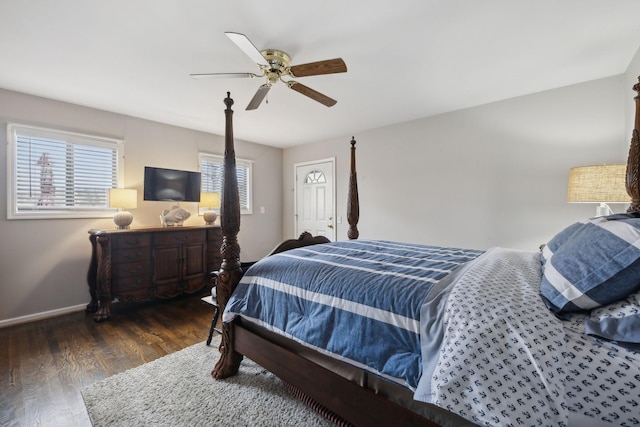 bedroom featuring ceiling fan and dark wood-type flooring