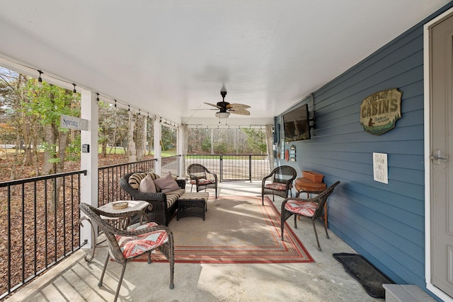 sunroom / solarium featuring ceiling fan and a healthy amount of sunlight