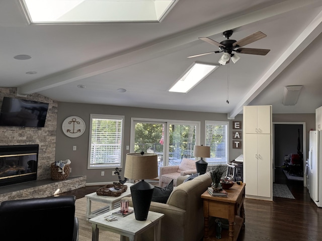 living room featuring a fireplace, dark hardwood / wood-style flooring, lofted ceiling with beams, and ceiling fan