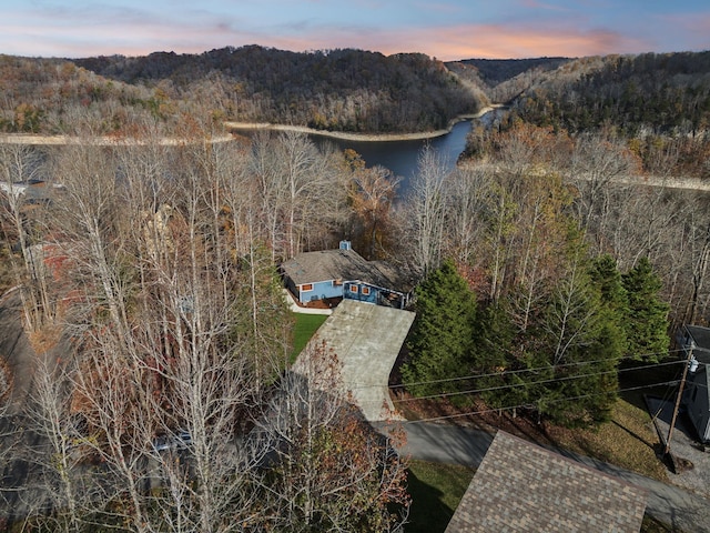 aerial view at dusk with a water view