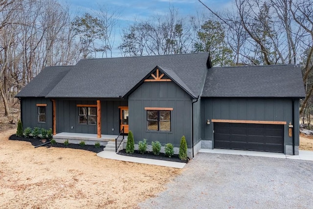 view of front of house featuring covered porch and a garage