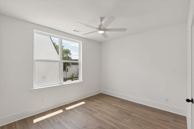 empty room featuring ceiling fan and wood-type flooring