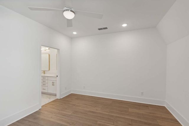 empty room with ceiling fan and light wood-type flooring