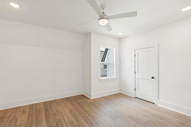 unfurnished room with ceiling fan and light hardwood / wood-style flooring