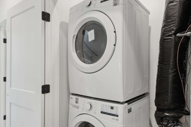 laundry room featuring stacked washing maching and dryer