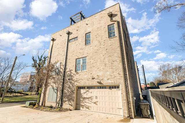 view of side of home with a garage