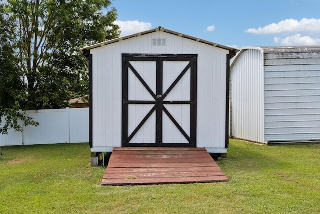 view of outdoor structure featuring a yard