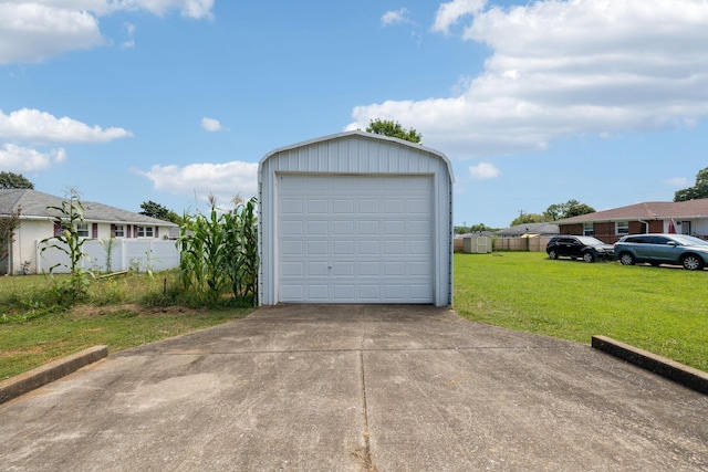 garage featuring a yard