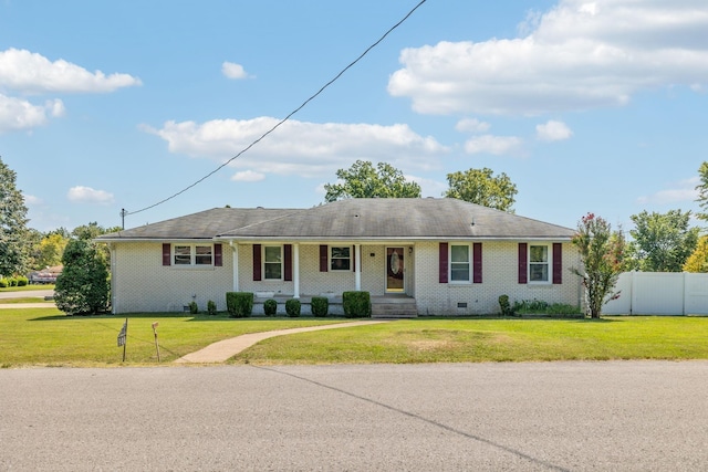 ranch-style house with a porch and a front yard