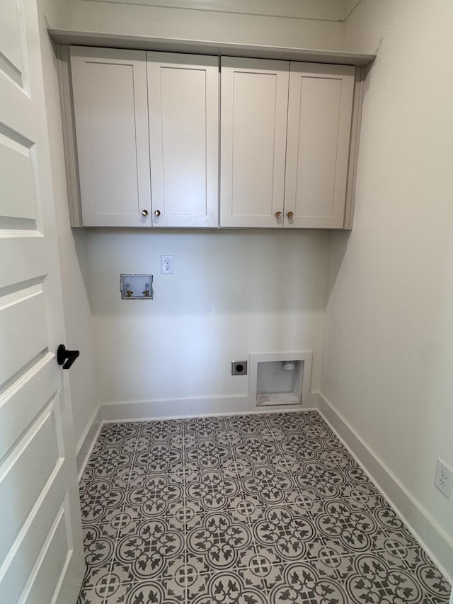 clothes washing area featuring washer hookup, cabinet space, baseboards, and electric dryer hookup