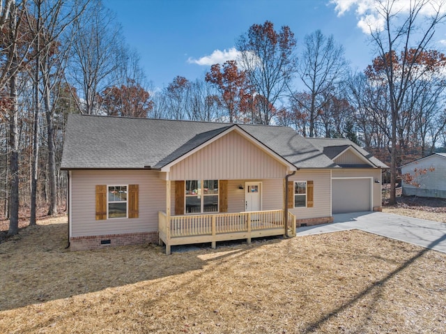 ranch-style house featuring a front yard, a porch, and a garage