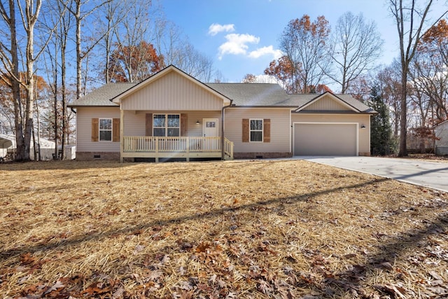 single story home featuring covered porch and a garage