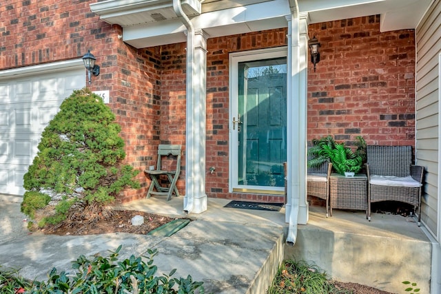 view of exterior entry featuring covered porch