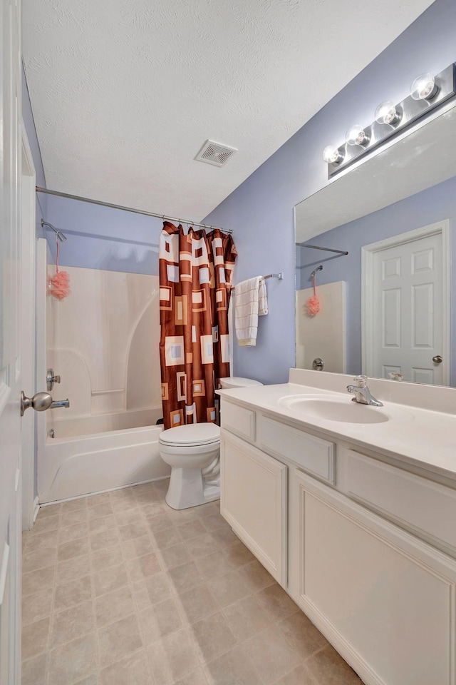 full bathroom with shower / bath combo, toilet, a textured ceiling, and vanity