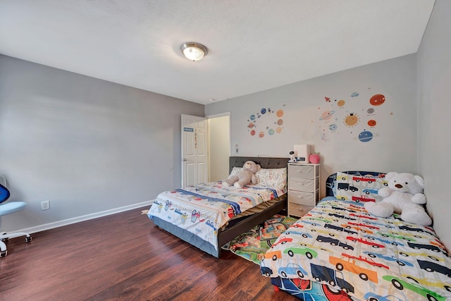 bedroom featuring dark hardwood / wood-style flooring