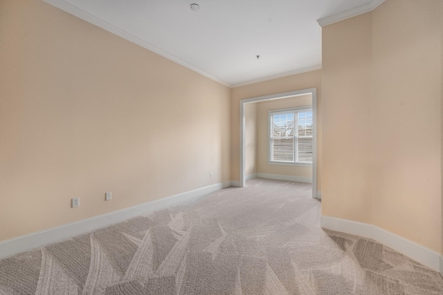 unfurnished room with light colored carpet and ornamental molding