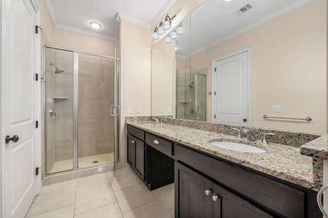 bathroom with tile patterned floors, crown molding, a shower with door, and vanity