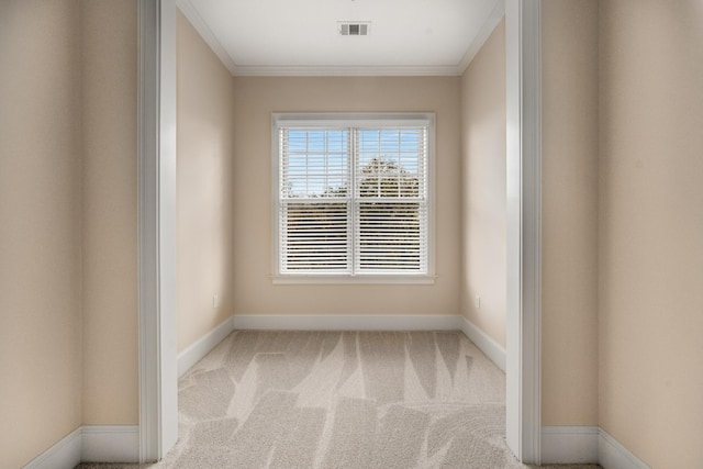 carpeted empty room with crown molding