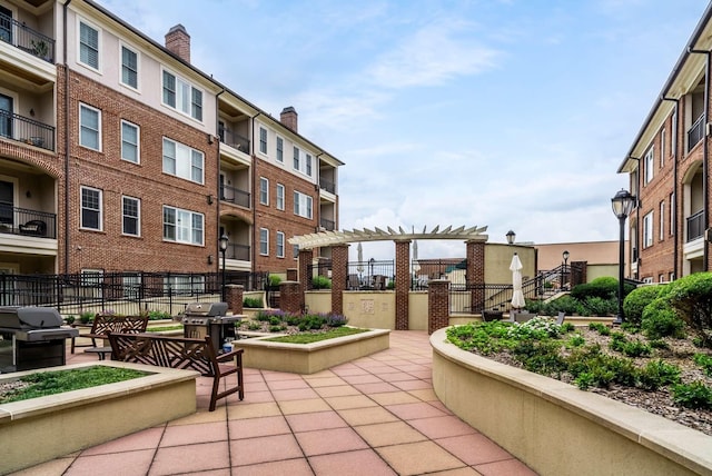 view of home's community featuring a patio area