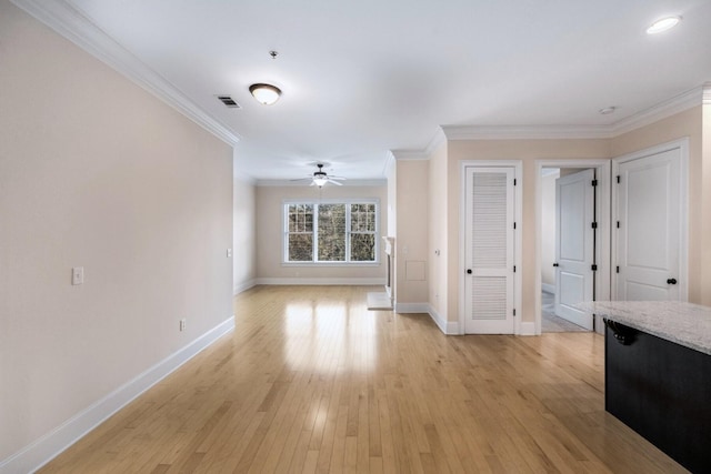 unfurnished living room with ceiling fan, light hardwood / wood-style floors, and ornamental molding