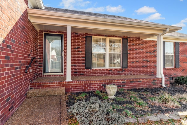 view of side of home with a porch