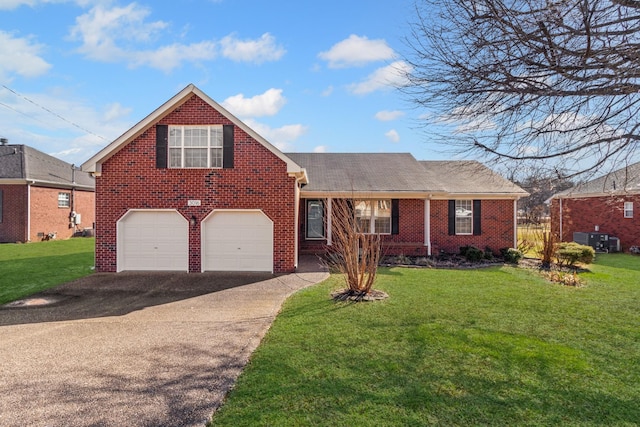 view of front of property with a garage and a front lawn