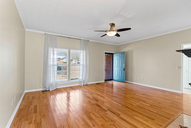 unfurnished room featuring ceiling fan, crown molding, and light hardwood / wood-style flooring