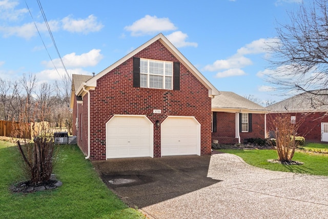 front facade featuring a garage and a front lawn