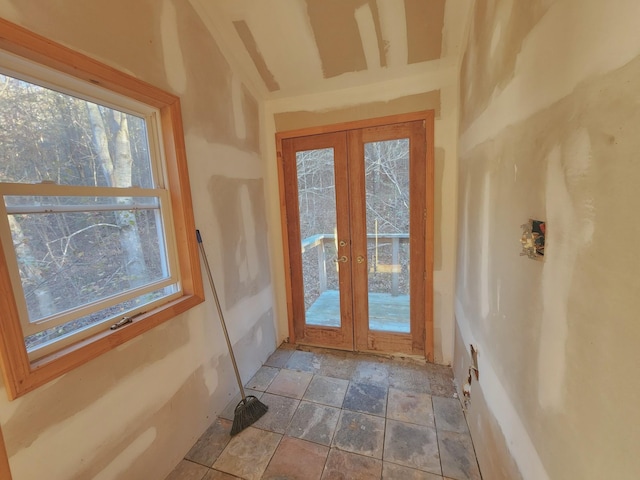 doorway to outside with a healthy amount of sunlight and french doors