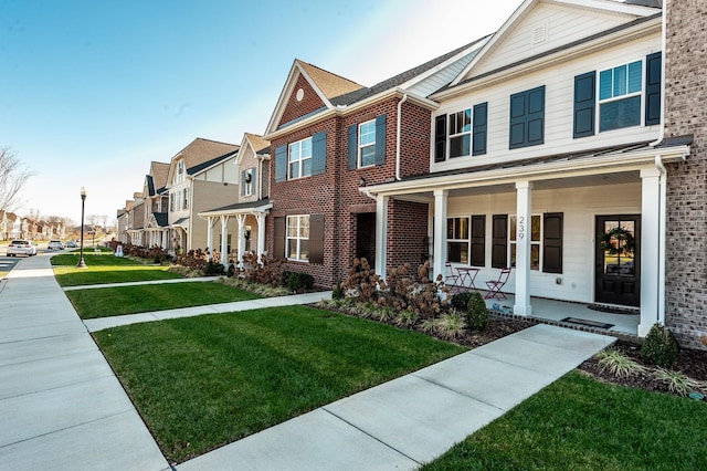 view of front of property with a front lawn and a porch