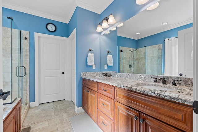 bathroom with vanity, ornamental molding, and walk in shower