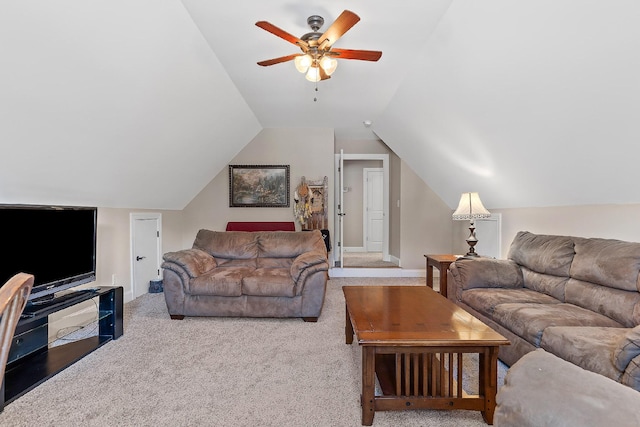 carpeted living room featuring ceiling fan and vaulted ceiling