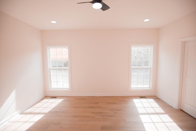 unfurnished room featuring ceiling fan and light hardwood / wood-style flooring