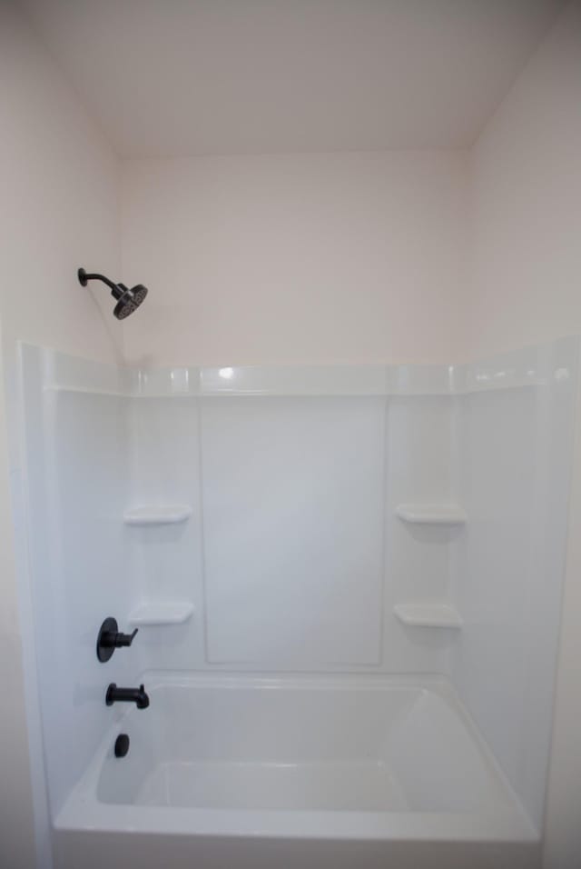 bathroom with shower / washtub combination