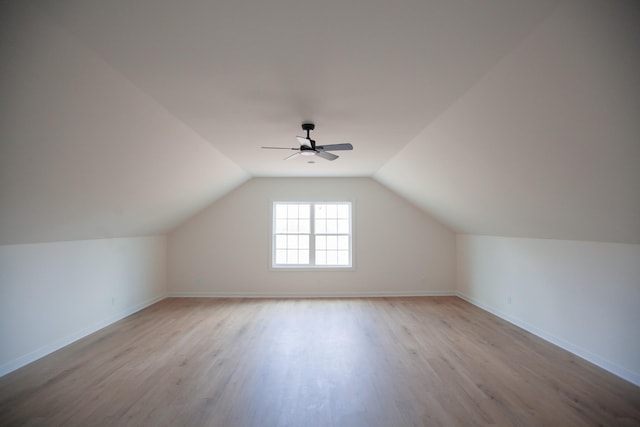 bonus room with lofted ceiling, light wood-type flooring, and ceiling fan