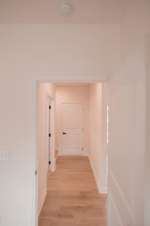 corridor featuring light hardwood / wood-style floors