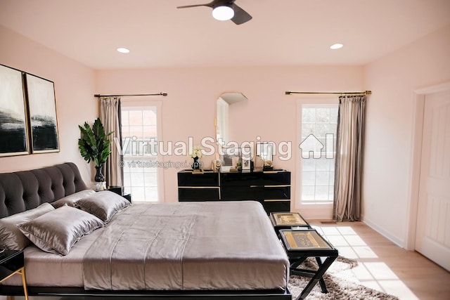 bedroom featuring ceiling fan and light wood-type flooring