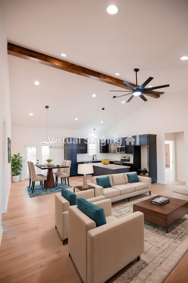 living room featuring ceiling fan, light hardwood / wood-style floors, beam ceiling, and high vaulted ceiling