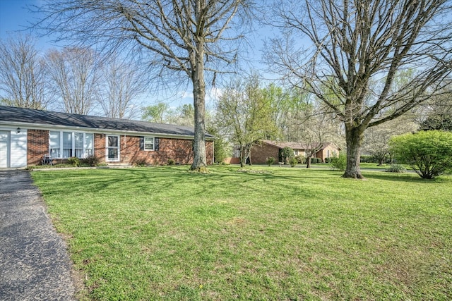 view of yard featuring a garage