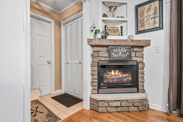 details with hardwood / wood-style flooring, a fireplace, and crown molding