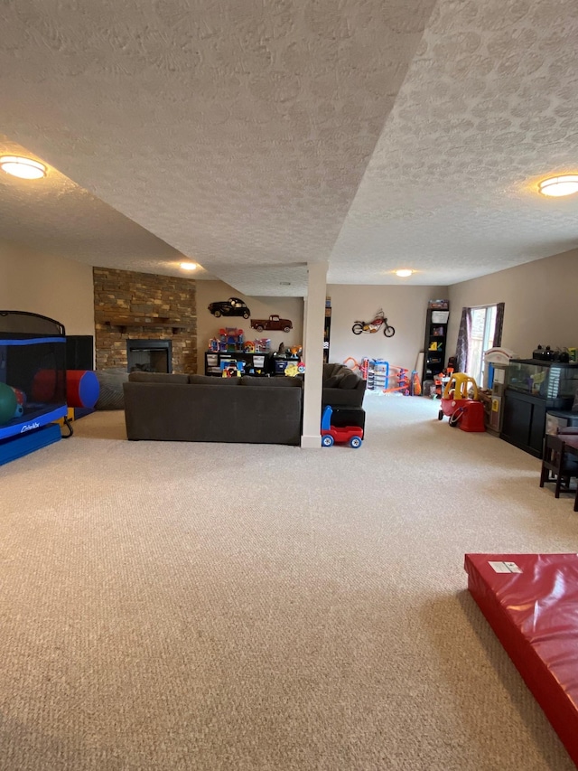 interior space with carpet flooring, a fireplace, and a textured ceiling