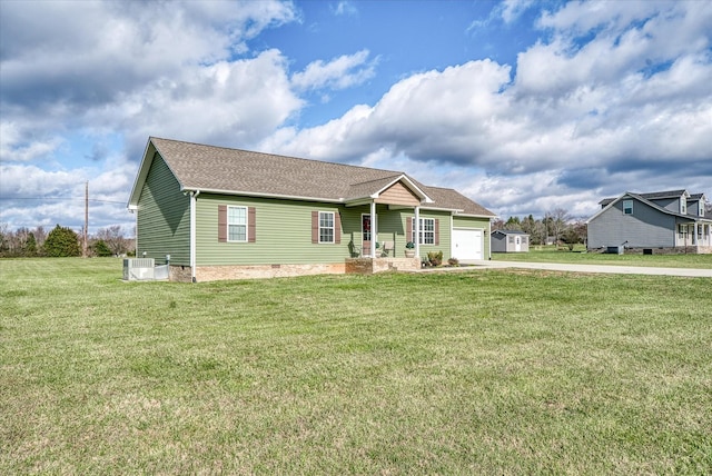 view of front of home with central AC, a garage, and a front lawn