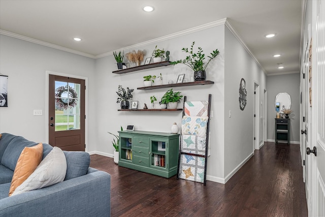 foyer entrance with crown molding and dark hardwood / wood-style floors