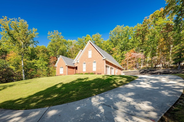 view of property exterior with a lawn