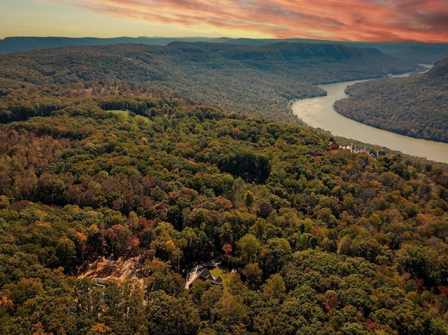 aerial view at dusk with a water and mountain view